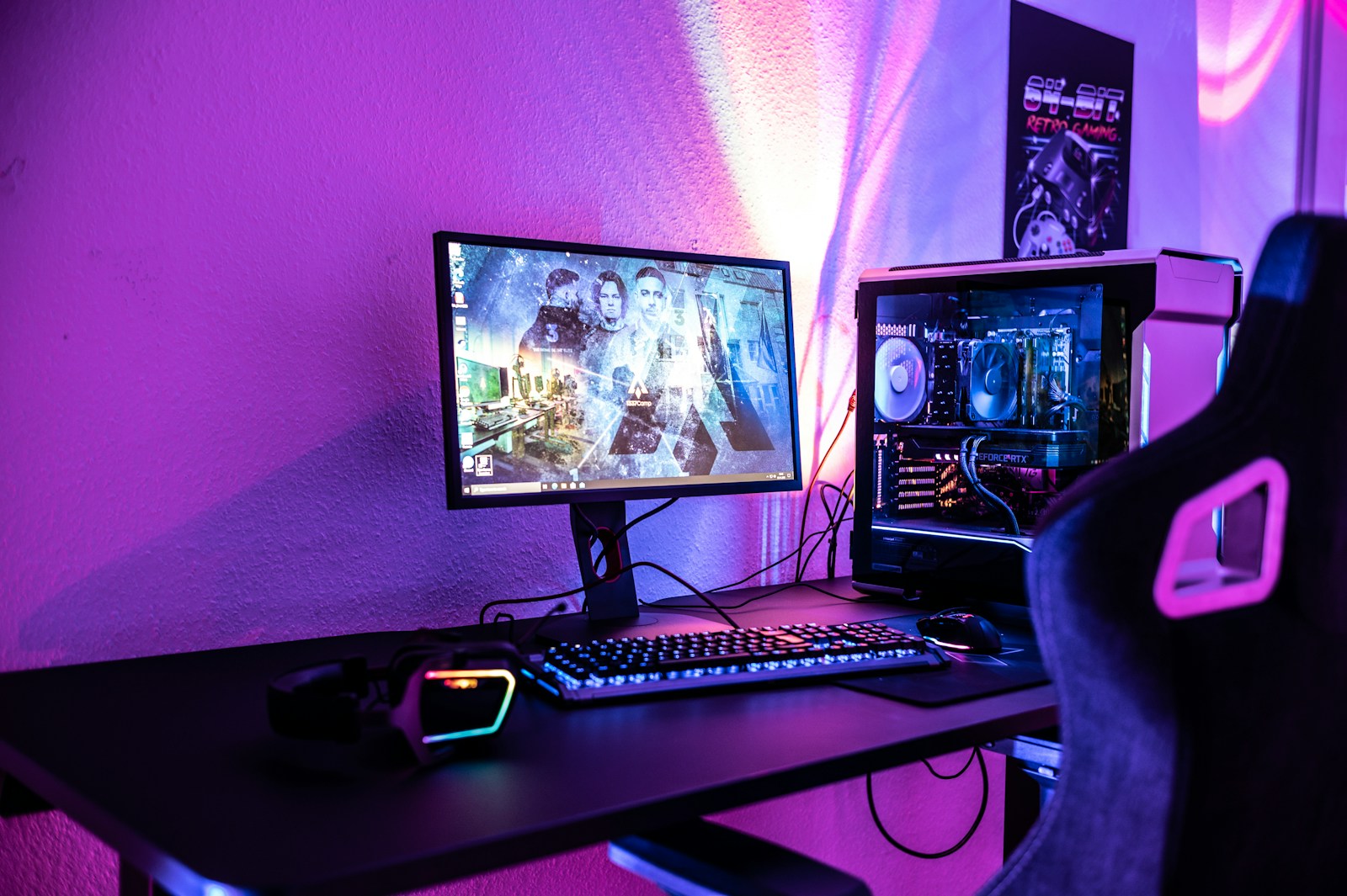 a desk with a computer and a gaming chair